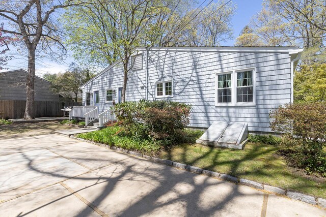 8 Parkside Ave, Miller Place, NY 11764 - view of side of home with fence