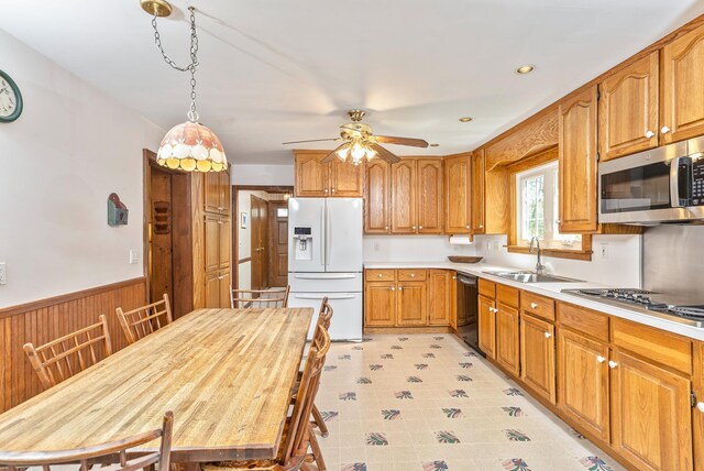 8 Parkside Ave, Miller Place, NY 11764 - kitchen featuring ceiling fan, white refrigerator with ice dispenser, a sink, stainless steel microwave, and black dishwasher
