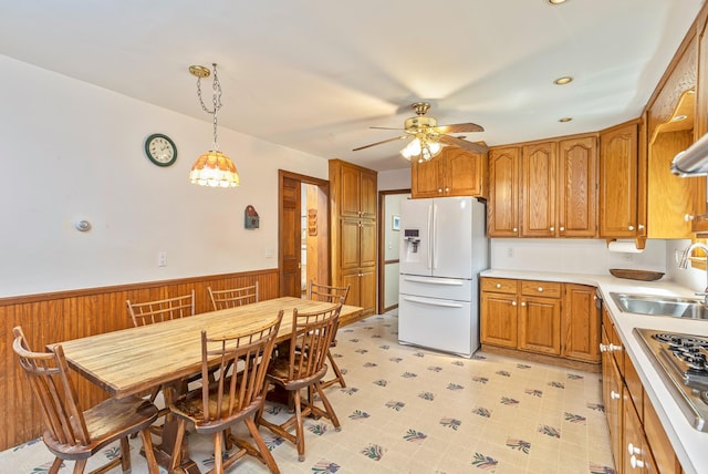 8 Parkside Ave, Miller Place, NY 11764 - kitchen with a sink, white fridge with ice dispenser, brown cabinets, and stainless steel stovetop