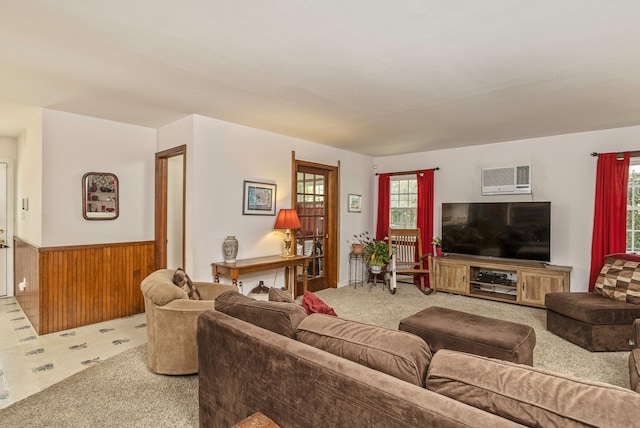 8 Parkside Ave, Miller Place, NY 11764 - living room with carpet floors, wainscoting, a healthy amount of sunlight, and wooden walls