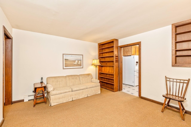 8 Parkside Ave, Miller Place, NY 11764 - living area featuring baseboards, light carpet, and baseboard heating