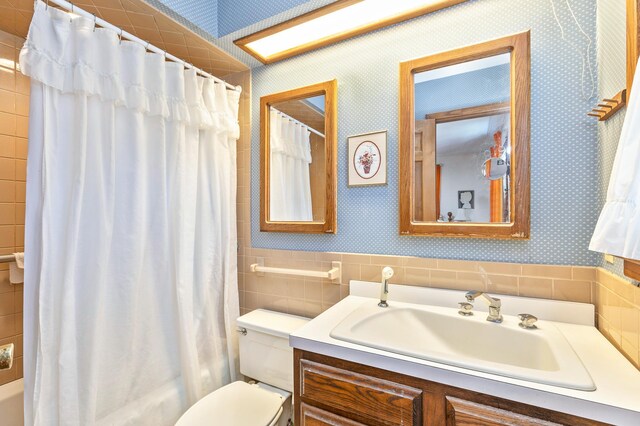 8 Parkside Ave, Miller Place, NY 11764 - bathroom featuring vanity, shower / tub combo, toilet, and tile walls