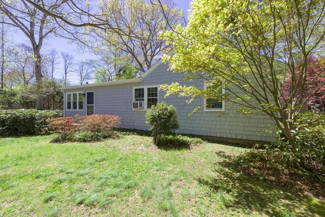 8 Parkside Ave, Miller Place, NY 11764 - view of side of home with a yard