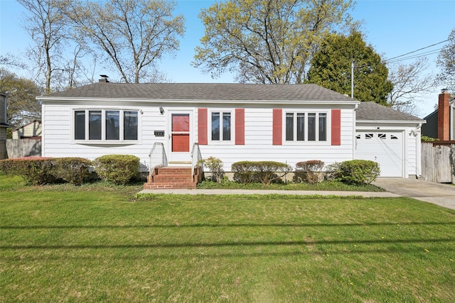 ranch-style house with fence, a shingled roof, driveway, and a front yard