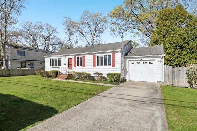 ranch-style house featuring a garage, a front lawn, fence, and driveway