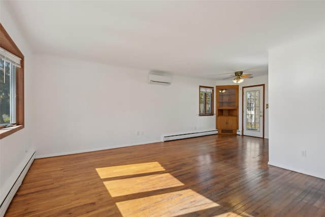 unfurnished room with an AC wall unit, baseboard heating, hardwood / wood-style flooring, and a baseboard radiator