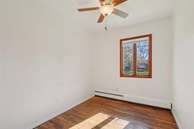 empty room featuring baseboards, ceiling fan, hardwood / wood-style flooring, and a baseboard radiator