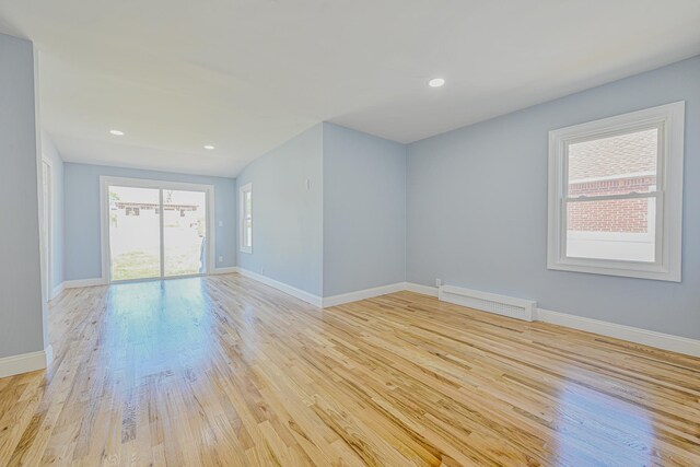 spare room with visible vents, recessed lighting, baseboards, and light wood-type flooring