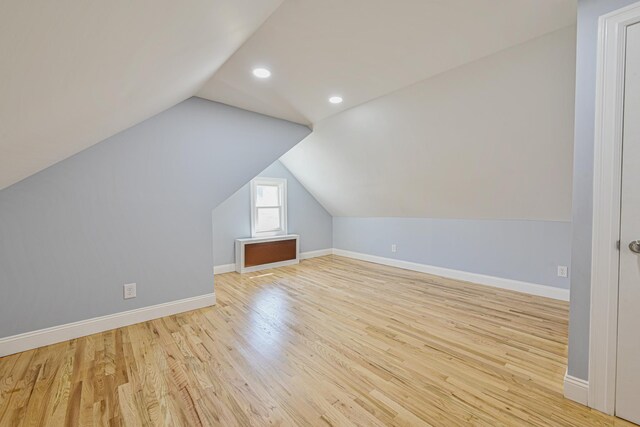 bonus room with baseboards, recessed lighting, wood finished floors, and vaulted ceiling