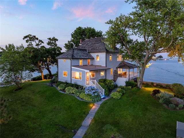 0 Rich, Greenwich, CT 06830 - view of front facade featuring a gazebo, a water view, a front lawn, and stairs