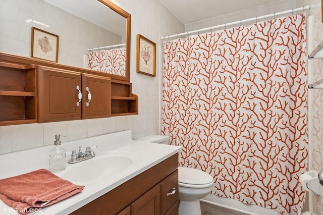 full bathroom with toilet and vanity