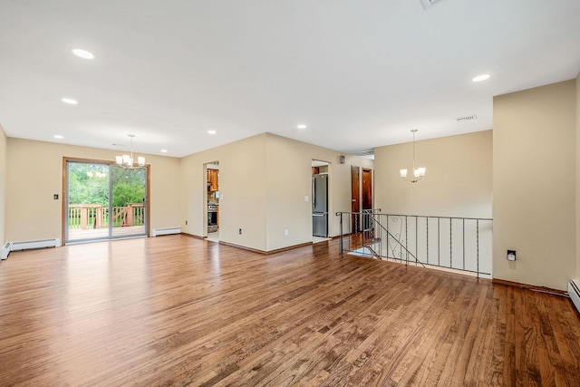 40 Cedarhurst St, Islip Terrace, NY 11752 - unfurnished living room featuring a chandelier, a baseboard heating unit, wood finished floors, recessed lighting, and baseboards