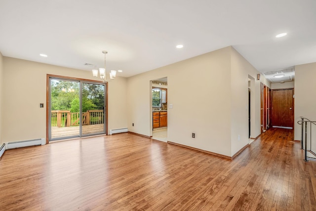 40 Cedarhurst St, Islip Terrace, NY 11752 - spare room with a baseboard radiator, light wood-type flooring, a chandelier, plenty of natural light, and recessed lighting