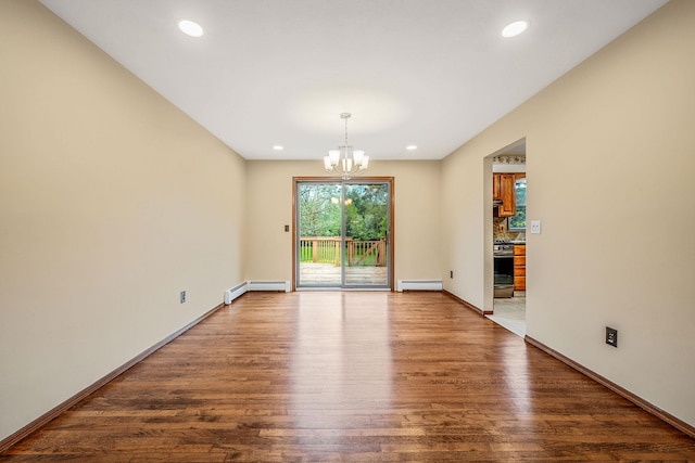 40 Cedarhurst St, Islip Terrace, NY 11752 - spare room with a chandelier, baseboard heating, a baseboard radiator, wood finished floors, and recessed lighting