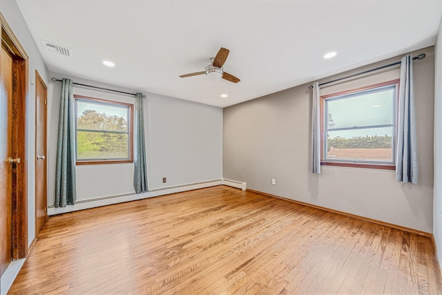 40 Cedarhurst St, Islip Terrace, NY 11752 - unfurnished room with baseboard heating, light wood-type flooring, a ceiling fan, baseboards, and recessed lighting