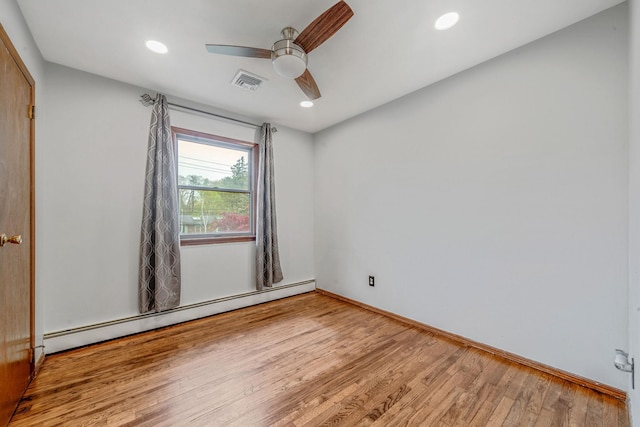 40 Cedarhurst St, Islip Terrace, NY 11752 - empty room with a baseboard radiator, a ceiling fan, wood finished floors, recessed lighting, and baseboards