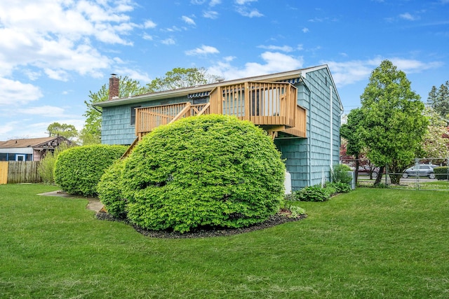 40 Cedarhurst St, Islip Terrace, NY 11752 - view of side of property with a chimney and a deck