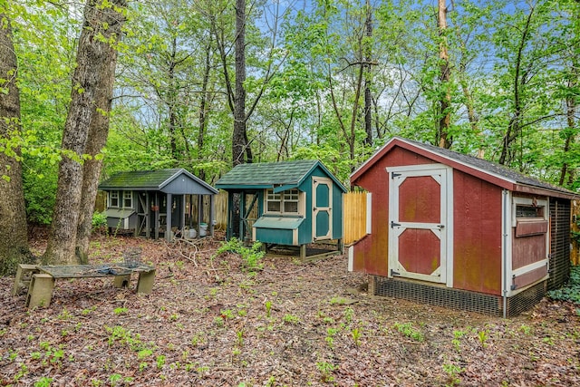 40 Cedarhurst St, Islip Terrace, NY 11752 - view of shed with exterior structure and view of scattered trees