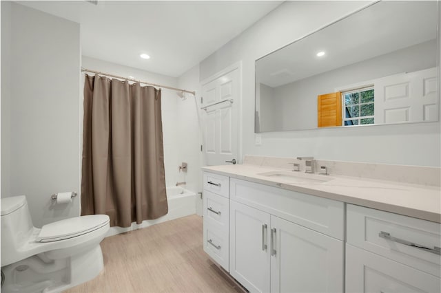 bathroom featuring shower / tub combo with curtain, vanity, toilet, recessed lighting, and wood finished floors