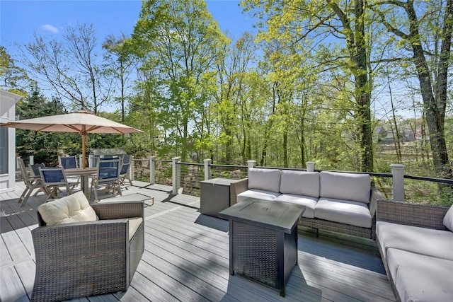 deck with outdoor dining area and outdoor lounge area