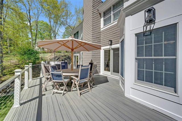 deck featuring outdoor dining area