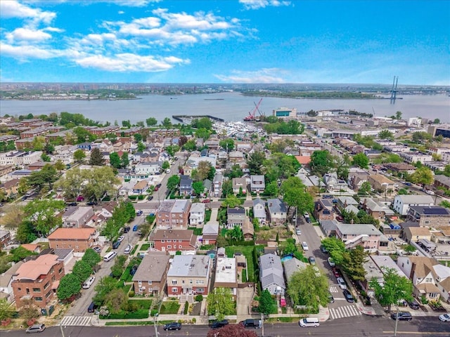 aerial view of residential area featuring a large body of water