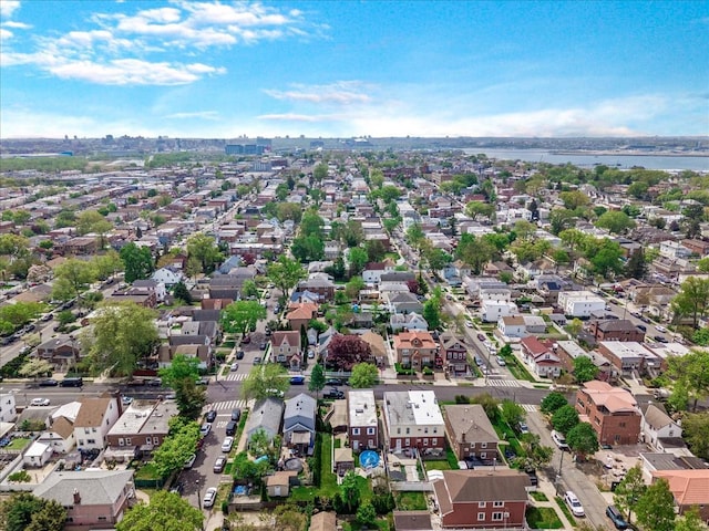 aerial perspective of suburban area featuring a large body of water