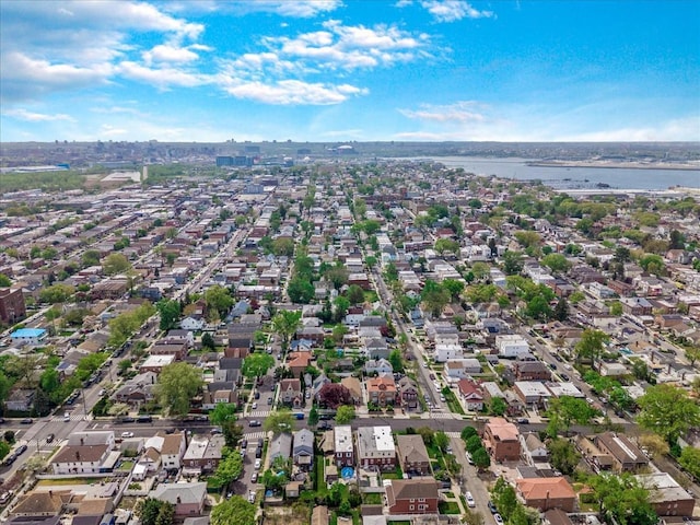 aerial view of residential area with a large body of water