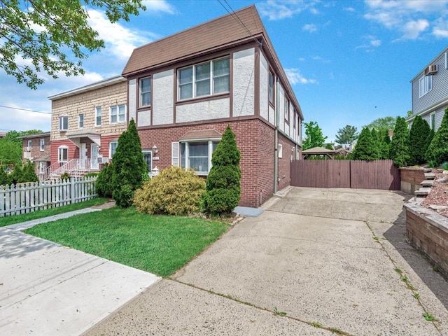 view of front of home with brick siding and driveway