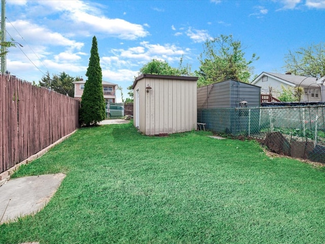 view of yard with a shed and an outbuilding