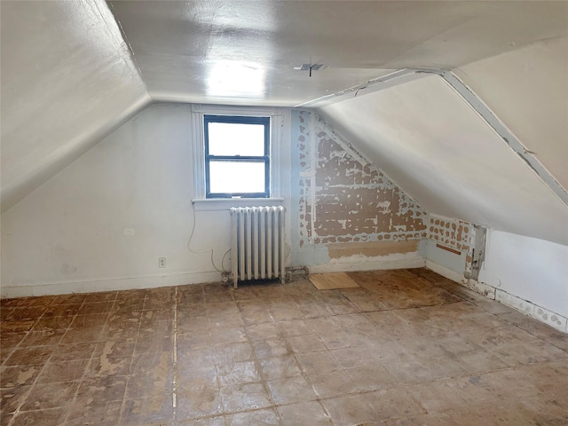 230 Sunnyside Ave, Brooklyn, NY 11207 - additional living space with baseboards, vaulted ceiling, and radiator heating unit