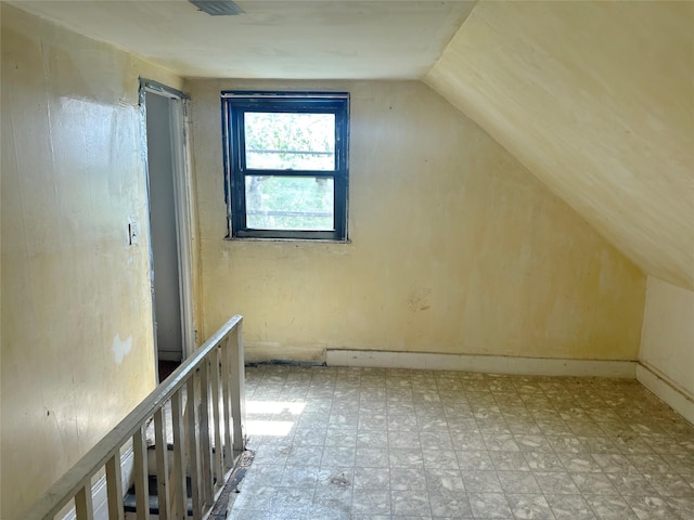 230 Sunnyside Ave, Brooklyn, NY 11207 - additional living space with tile patterned floors and vaulted ceiling
