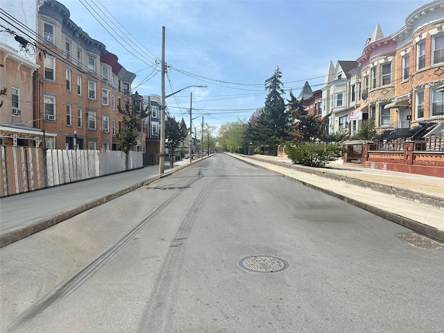 230 Sunnyside Ave, Brooklyn, NY 11207 - view of road with a residential view, sidewalks, street lighting, and curbs
