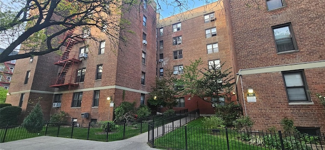 view of building exterior with fence