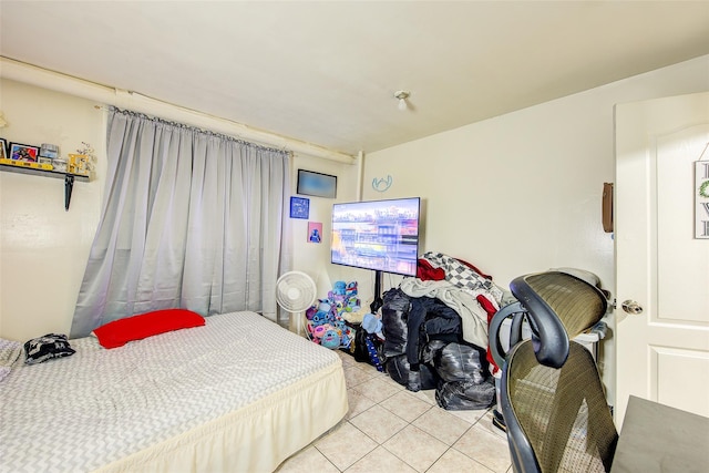 bedroom featuring light tile patterned floors