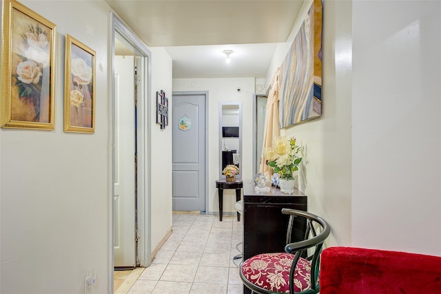 corridor with light tile patterned floors
