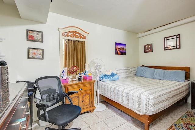 bedroom featuring light tile patterned floors