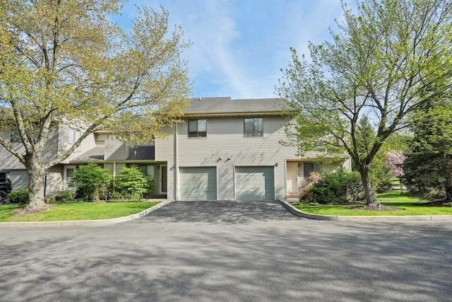 view of front of home featuring driveway and a garage