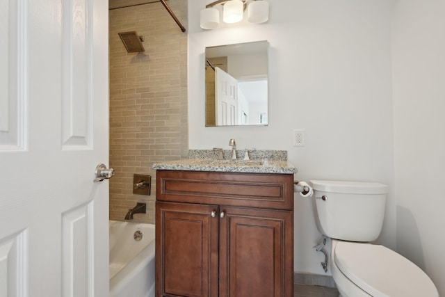 bathroom featuring vanity, toilet, and shower / washtub combination