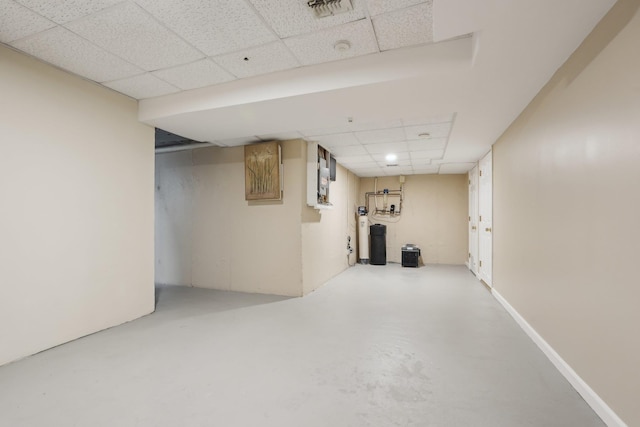 finished below grade area featuring visible vents and a drop ceiling