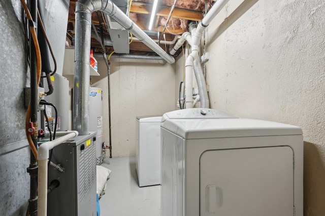 clothes washing area with laundry area and washing machine and clothes dryer