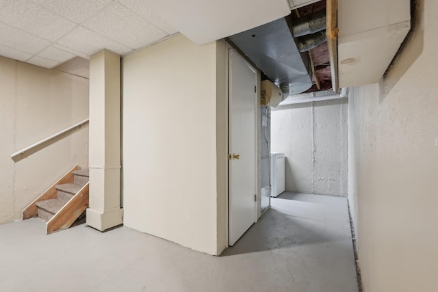 below grade area featuring washer / clothes dryer and stairs