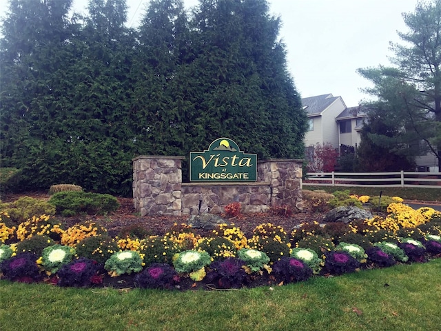 community sign with fence