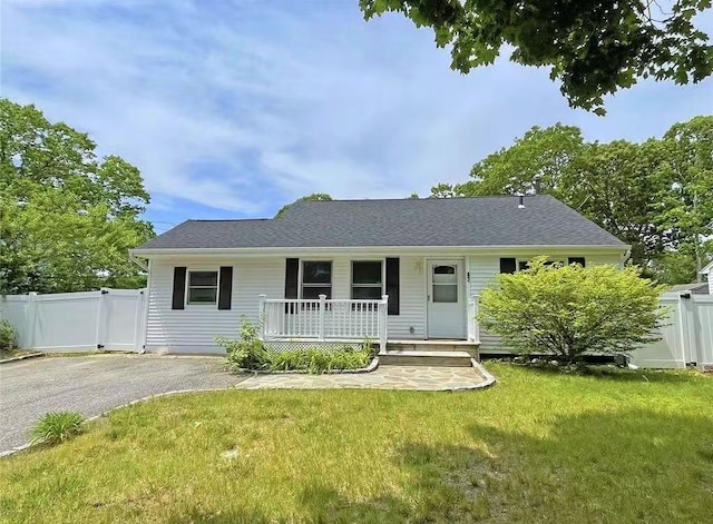 47 Ontario St, Port Jefferson Station, NY 11776 - view of front facade with fence, a porch, and a front yard