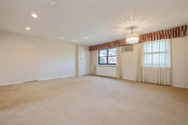 19-32 202nd St Apt # 1-179, Whitestone, NY 11360 - empty room featuring light colored carpet, recessed lighting, baseboards, and a notable chandelier