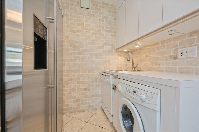 19-32 202nd St Apt # 1-179, Whitestone, NY 11360 - laundry area with a sink, washer / dryer, and light tile patterned flooring
