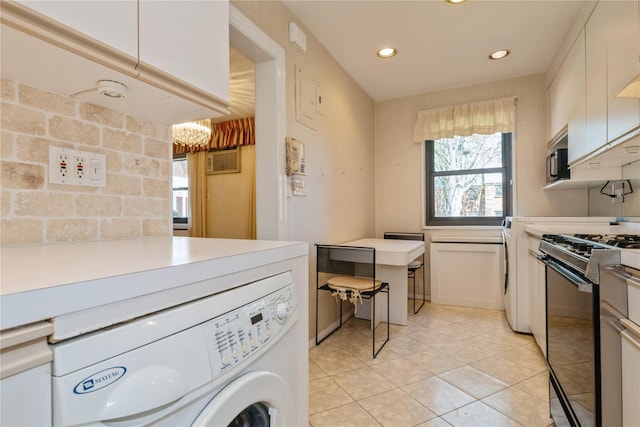 19-32 202nd St Apt # 1-179, Whitestone, NY 11360 - laundry area with laundry area, light tile patterned floors, a chandelier, washer / dryer, and recessed lighting