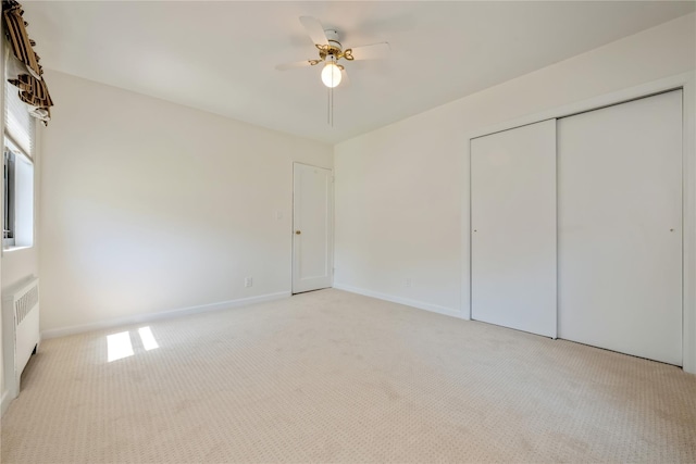 19-32 202nd St Apt # 1-179, Whitestone, NY 11360 - unfurnished bedroom featuring ceiling fan, light colored carpet, radiator heating unit, baseboards, and a closet