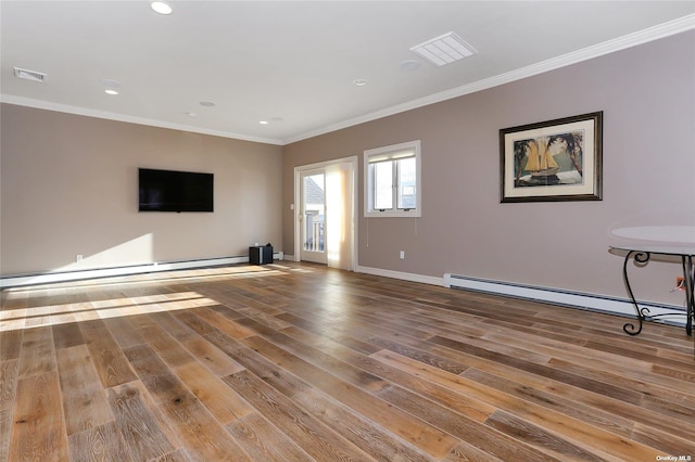 unfurnished living room featuring baseboards, visible vents, wood finished floors, and a baseboard radiator
