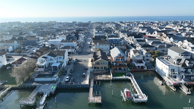 bird's eye view featuring a water view and a residential view
